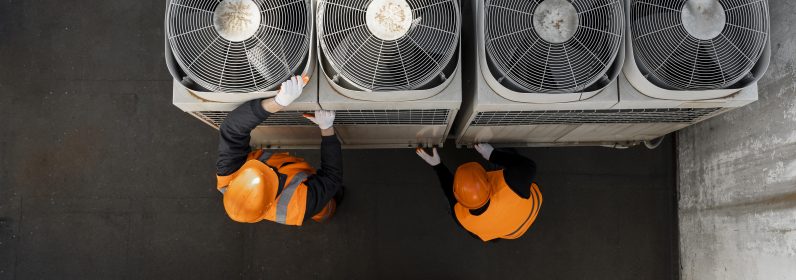 men-working-with-equipment-full-shot