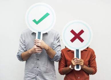 People holding yes or no signs
