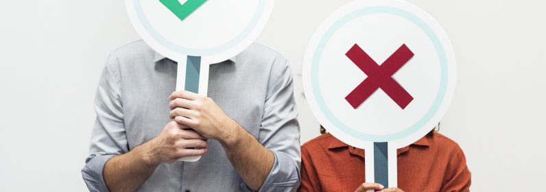 People holding yes or no signs